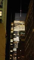 The New York city night view with the lights on in the skyscrapers at night photo