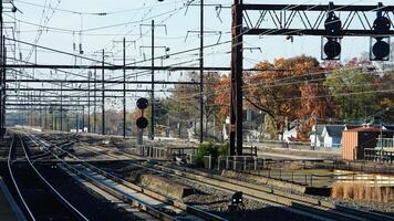 The train station view with the iron tracks near the platform photo