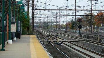 The train station view with the iron tracks near the platform photo