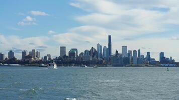 The New York manhattan view from the ferry boat in the sunny day photo