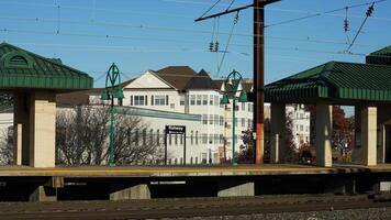 The train station view with the iron tracks near the platform photo