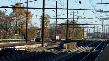 The train station view with the iron tracks near the platform photo
