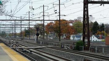 The train station view with the iron tracks near the platform photo