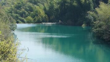 The beautiful lake landscapes with the green forest as background in the countryside of the China photo