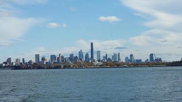 The New York manhattan view from the ferry boat in the sunny day photo