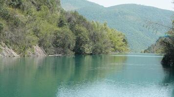 The beautiful lake landscapes with the green forest as background in the countryside of the China photo
