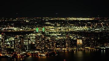The New York city night view with the lights on in the skyscrapers at night photo