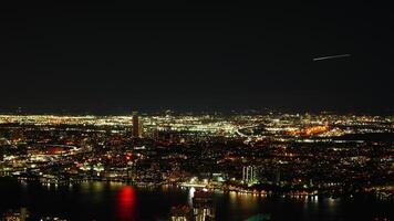 The New York city night view with the lights on in the skyscrapers at night photo
