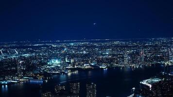 The New York city night view with the lights on in the skyscrapers at night photo
