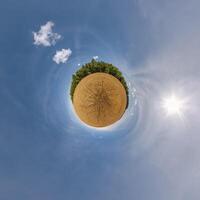simple little tiny planet without buildings in blue sky with beautiful clouds. Transformation of spherical panorama 360 degrees. Spherical abstract aerial view. Curvature of space. photo