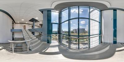 hdri 360 panorama on emergency and evacuation exit stairs in empty modern hall with columns, doors and panoramic windows in office building in spherical equirectangular projection, for AR VR content photo