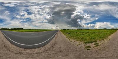 spherical 360 hdri panorama on side of asphalt road with rain storm clouds in dark sky in equirectangular seamless projection, as skydome replacement in drone panoramas, game development photo