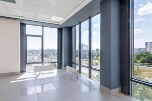 panorama view in empty modern hall with columns, doors and panoramic windows. photo
