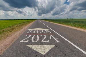 numbers 2024, 2025 on asphalt road highway. concept of destination in future, freedom, work start, run, planning, challenge, target, new year photo