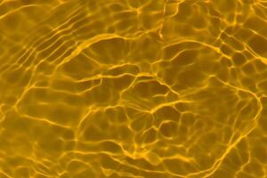 Blue water with ripples on the surface. Defocus blurred transparent blue colored clear calm water surface texture with splashes and bubbles. Water waves with shining pattern texture background. photo