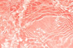 Blue water with ripples on the surface. Defocus blurred transparent blue colored clear calm water surface texture with splashes and bubbles. Water waves with shining pattern texture background. photo