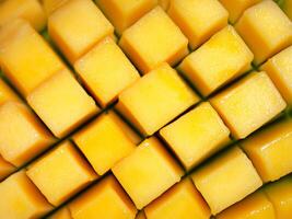 fresh mango slices on white background. top view photo