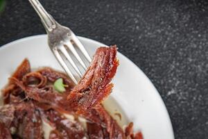 anchovies in a plate on the table canned fish in oil fresh and tasty seafood meal food snack on the table copy space food background rustic photo