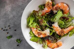 shrimp salad prawns or langoustines green leaf lettuce mix fresh meal food snack on the table copy space food background rustic top view photo
