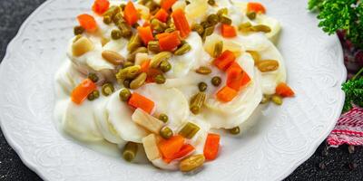 potatoes with vegetables second course natural fresh appetizer meal food snack on the table copy space food background rustic top view keto or paleo diet photo