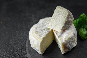 soft cheese cow milk, goat or sheep cheese natural fresh appetizer meal food snack on the table copy space food background rustic top view photo