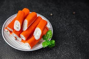 crab stick stuffing cream cheese and herbs natural fresh appetizer meal food snack on the table copy space food background rustic top view photo