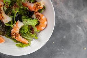 salad shrimp or prawns langoustines green leaf lettuce mix fresh meal food snack on the table photo