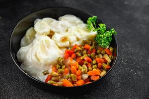 potatoes with vegetables second course natural fresh appetizer meal food snack on the table copy space food background rustic top view keto or paleo diet photo
