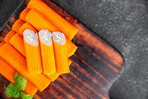 crab stick stuffing cream cheese and herbs natural fresh appetizer meal food snack on the table copy space food background rustic top view photo