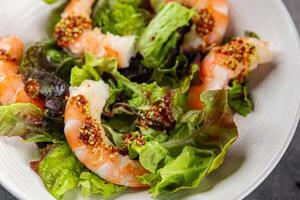 shrimp salad prawns or langoustines green leaf lettuce mix fresh meal food snack on the table copy space food background rustic top view photo