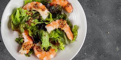 shrimp salad prawns or langoustines green leaf lettuce mix fresh meal food snack on the table copy space food background rustic top view photo