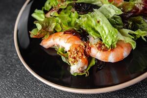 shrimp salad prawns or langoustines green leaf lettuce mix fresh meal food snack on the table copy space food background rustic top view photo
