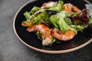 shrimp salad prawns or langoustines green leaf lettuce mix fresh meal food snack on the table copy space food background rustic top view photo