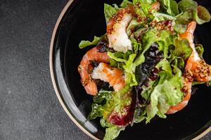 shrimp salad prawns or langoustines green leaf lettuce mix fresh meal food snack on the table copy space food background rustic top view photo