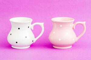 White Vintage Ayran Cup with Black Dot Pattern on a Purple Background photo