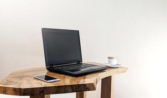 Mockup of laptop computer with empty screen with coffee cup and smartphone on table of the coffee shop background,White background photo