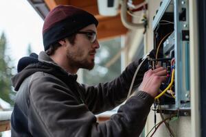 An HVAC technician installing a new heating and cooling system in a home. AI generate photo