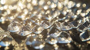 Many clear glass drops are arranged in an intricate pattern on the surface. photo