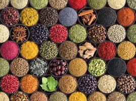 Fresh spices and herbs for food. Colorful condiments as background, top view. lot seasonings in cups, on table photo
