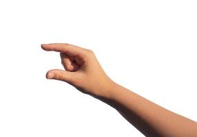 Kids hand holding something invisible, empty space between two fingers, isolated on white background photo
