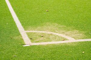 white corner markings on a football pitch photo