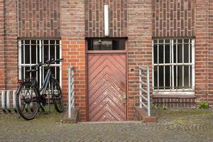 cellar entrance with bicycle in the sun photo