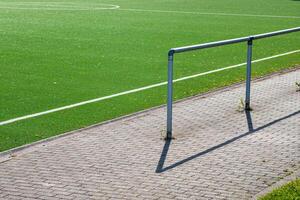 barrier at an artificial turf pitch photo