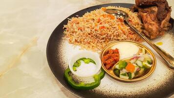 Kebuli rice nasi kebuli closeup of Arabic food on the table with empty space next to it, top angle 45 degreesa photo