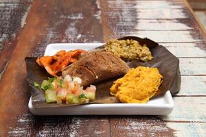 Bahian dish with acaraje, abara, caruru and vinaigrette sauce photo