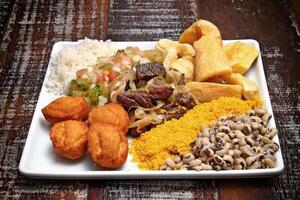 Bahian dish with acaraje, abara, caruru and vinaigrette sauce photo