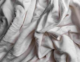 Background concept. Blankets that are still wrinkled have been used. The white blanket is crumpled and shabby. Pattern texture background photo