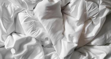 Background concept. Soft bed sheets that are still wrinkled after being used. The white bed sheets were crumpled and shabby. Pattern texture background. photo