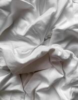 Background concept. Soft bed sheets that are still wrinkled after being used. The white bed sheets were crumpled and shabby. Pattern texture background. photo