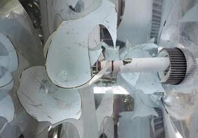 Sharp glass shards of a broken induction lamp photo